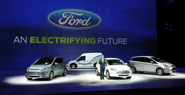 Bill Ford, Executive Chairman of Ford Motors stands with (L-R) the C-MAX electric car, the Transit Connect electric truck, the Focus electric car and the C-MAX hybrid during the first press preview day at the 2011 North American International Auto Show January 10, 2011 in Detroit, Michigan. AFP PHOTO/Stan HONDA (Photo credit should read STAN HONDA/AFP/Getty Images)