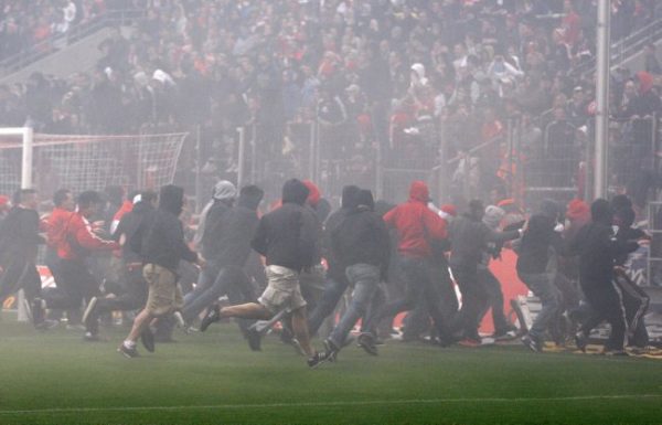 Cologne soccer supporters run on the pitch after the German first division Bundesliga soccer match between 1. FC Cologne and Bayern Munich in Cologne, Saturday, May 5, 2012. Cologne lost 1-4 and is relegated from the first division. (AP Photo/Michael Probst) NO MOBILE USE UNTIL 2 HOURS AFTER THE MATCH, WEBSITE USERS ARE OBLIGED TO COMPLY WITH DFL-RESTRICTIONS, SEE INSTRUCTIONS FOR DETAILS